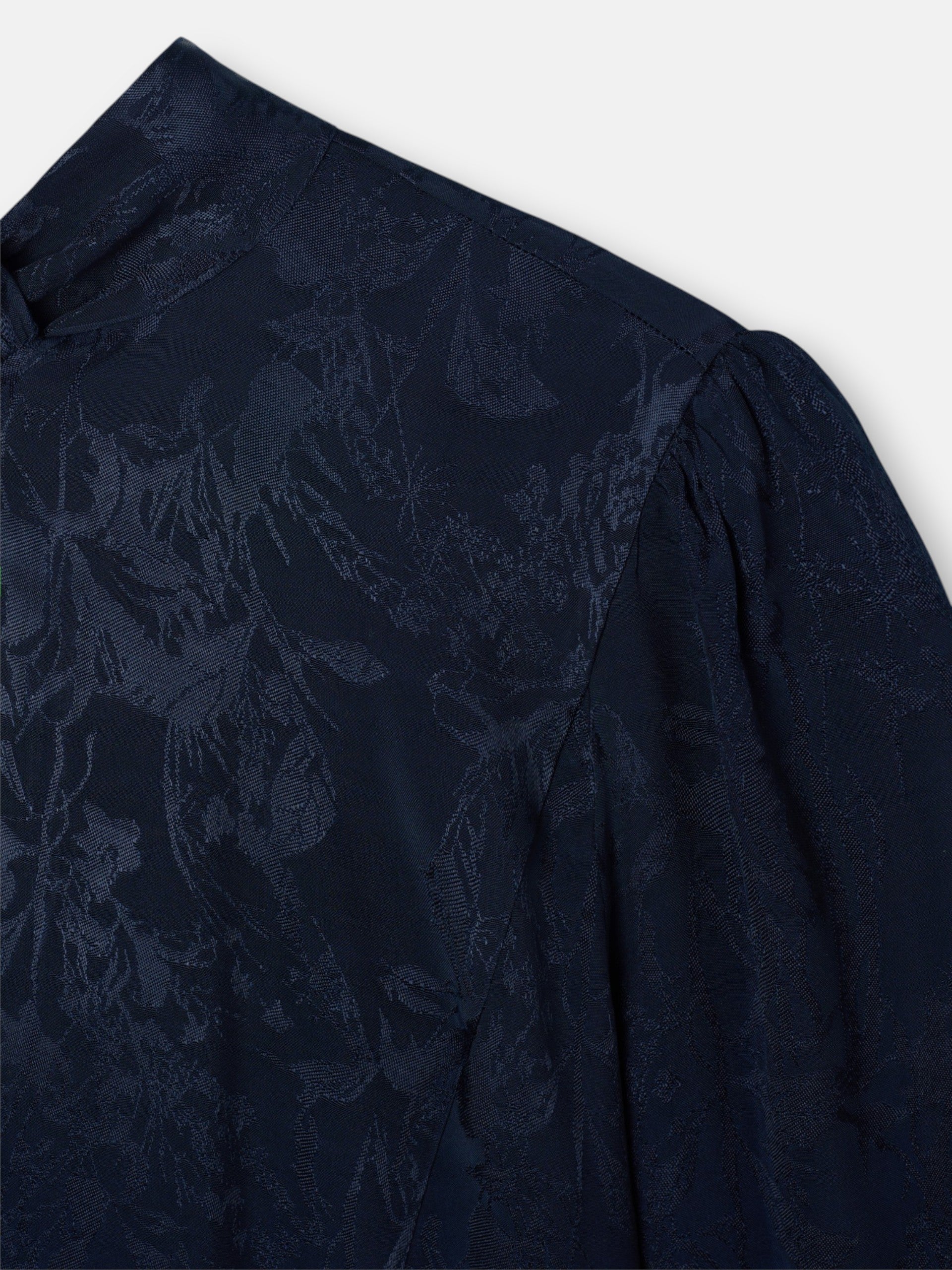 Blue jacquard neck strap blouse
