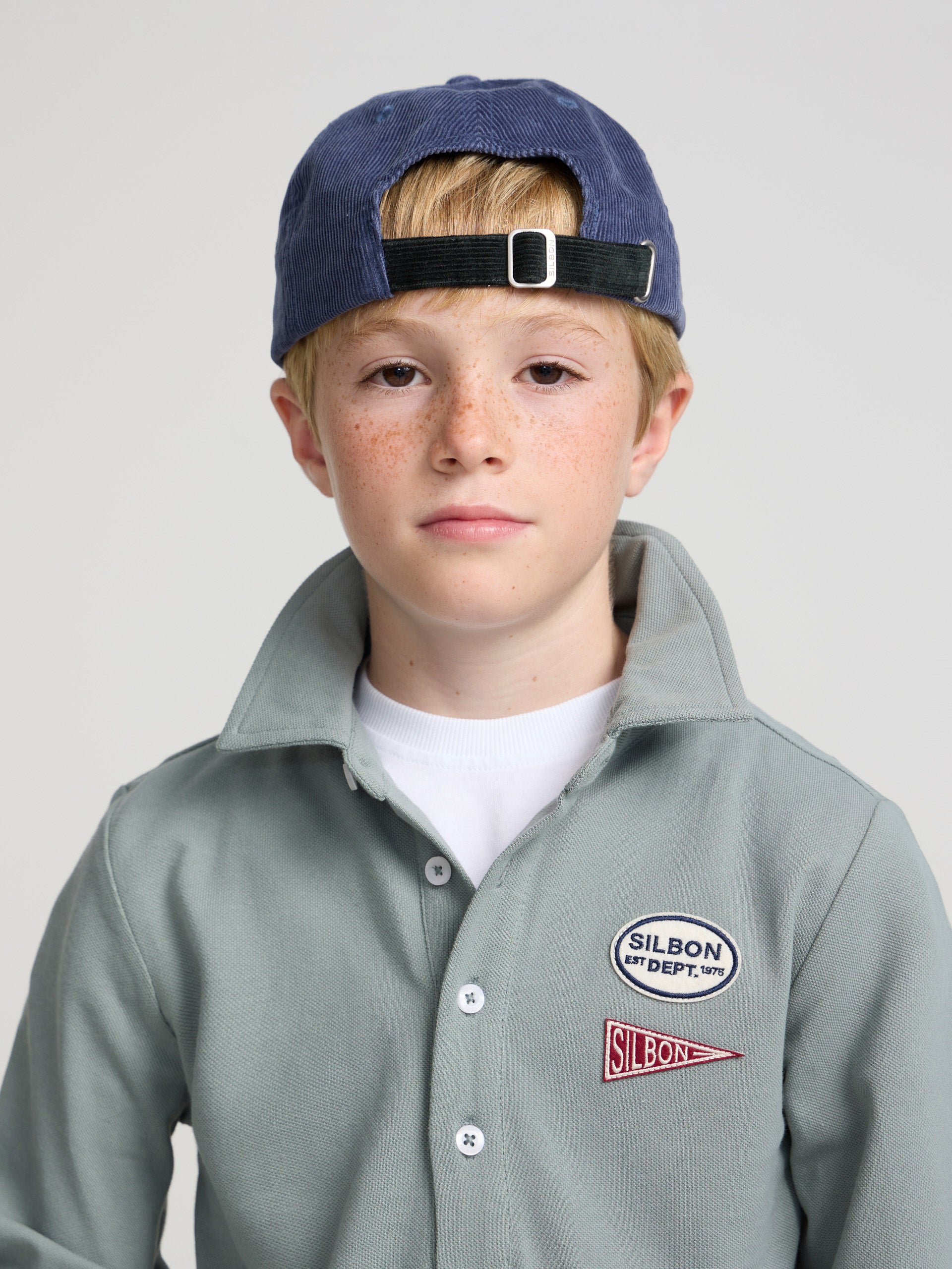 Green kids' polo with patches
