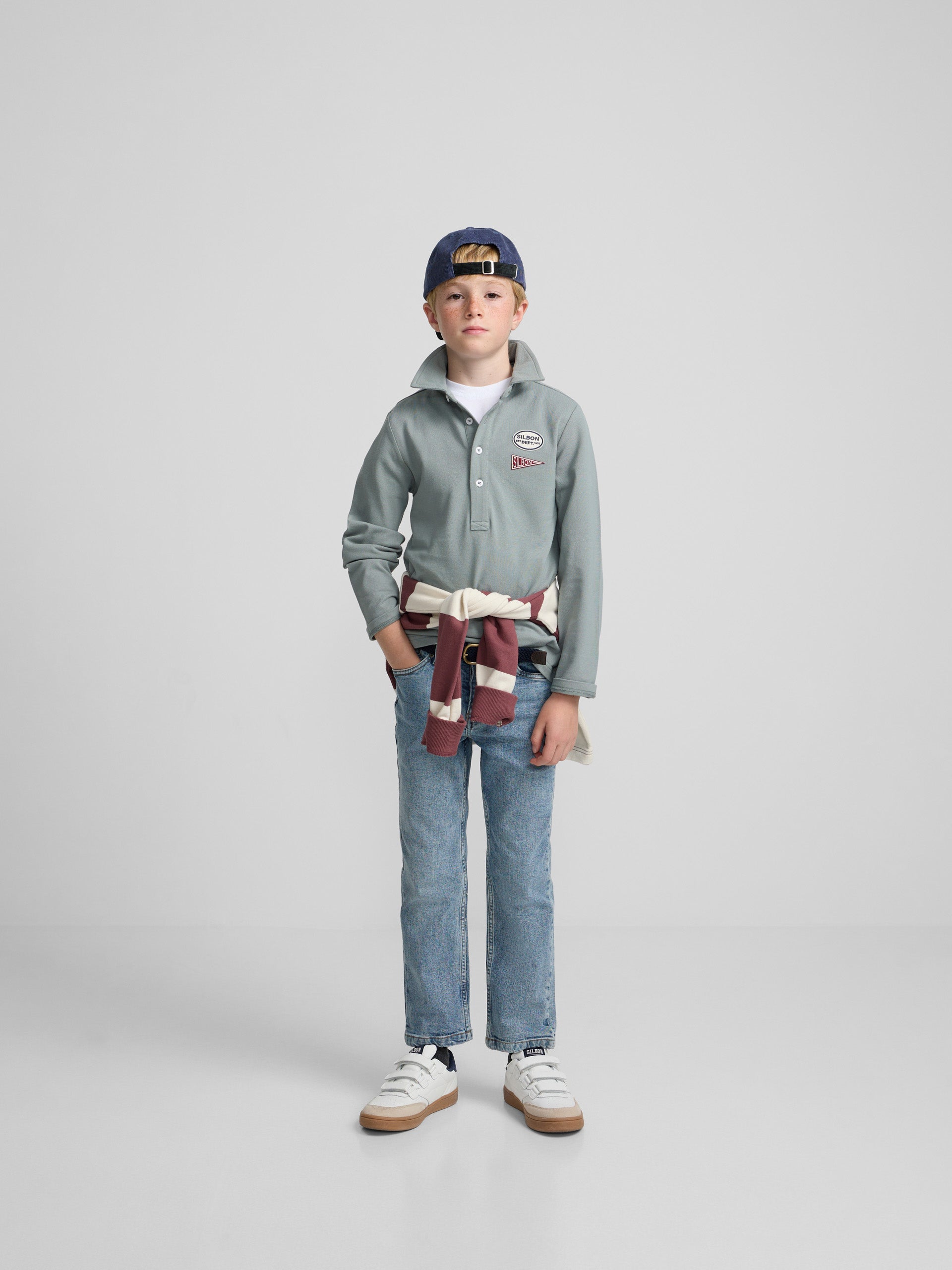 Green kids' polo with patches