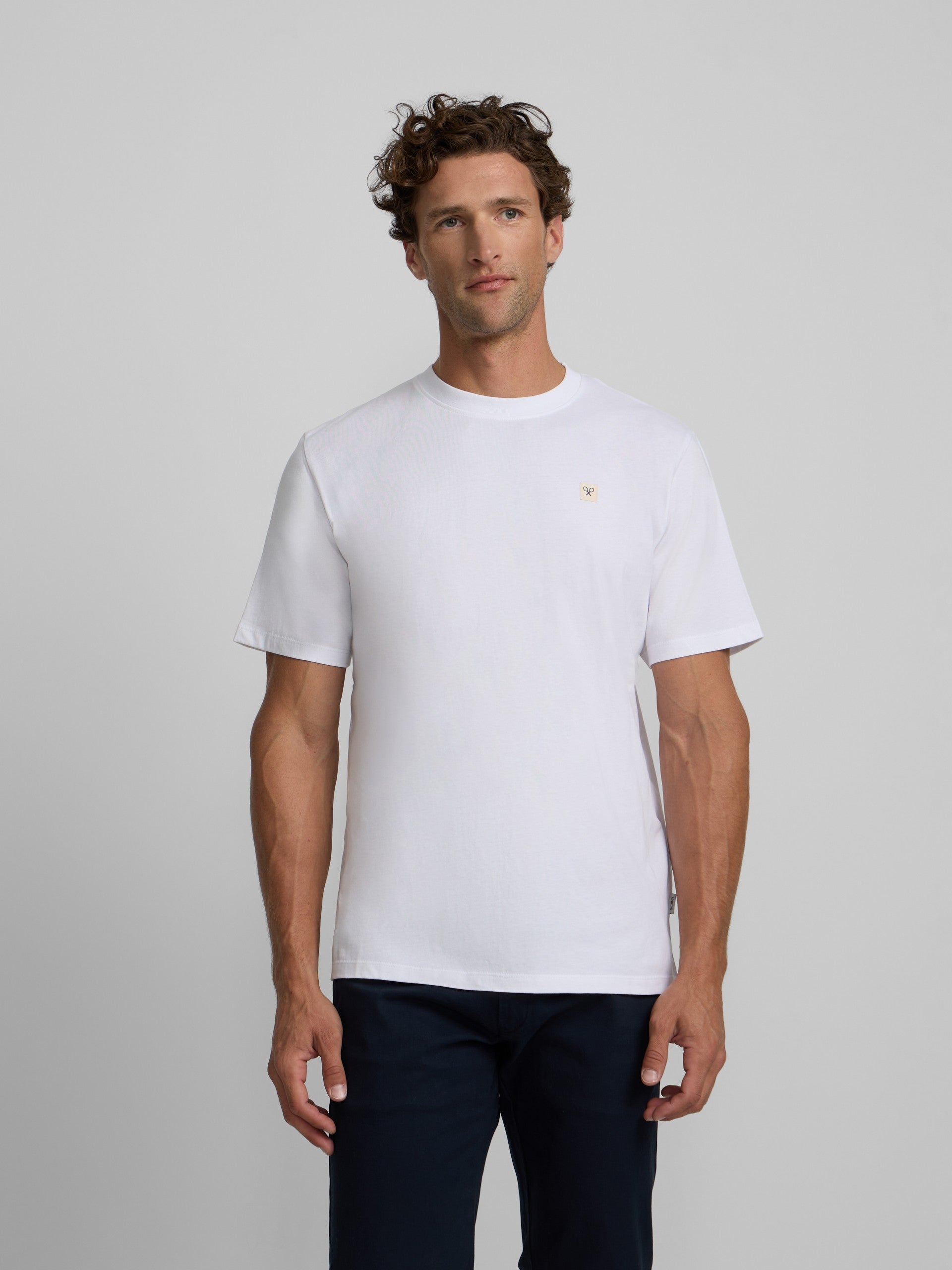 Plain white t-shirt with mini logo patch