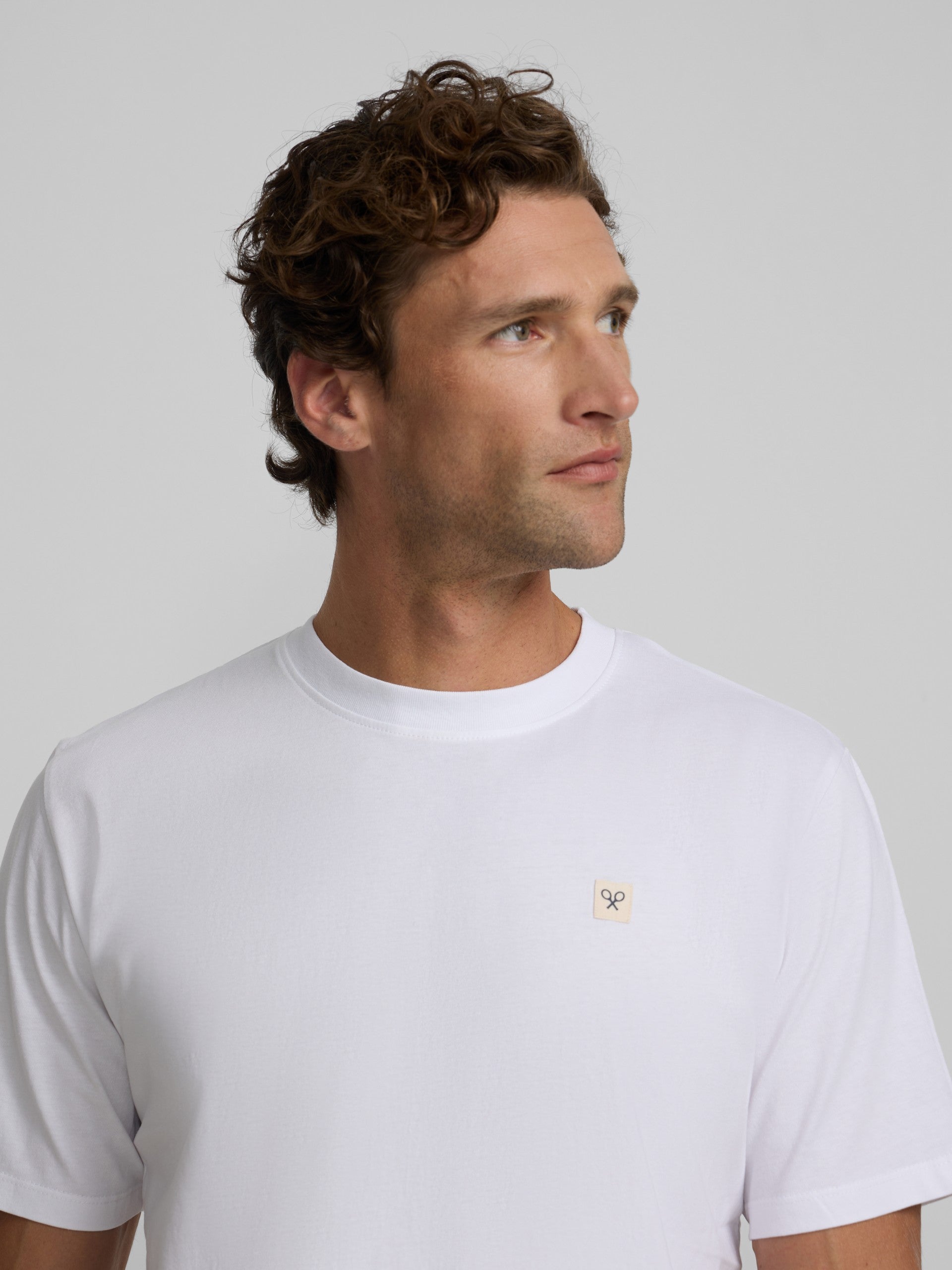 Plain white t-shirt with mini logo patch