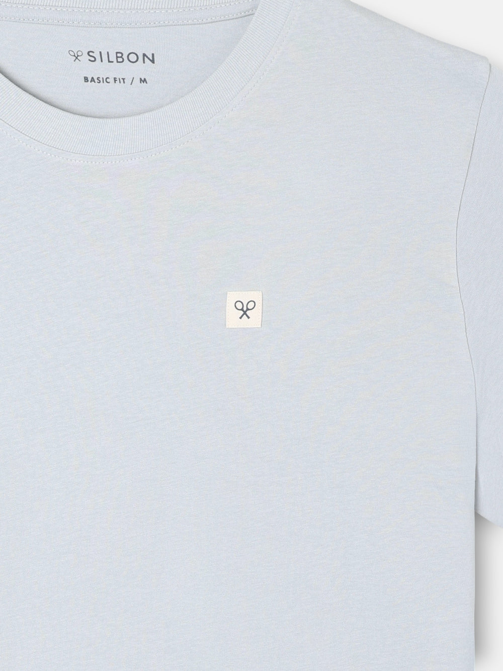 Camiseta lisa minilogo parche azul claro