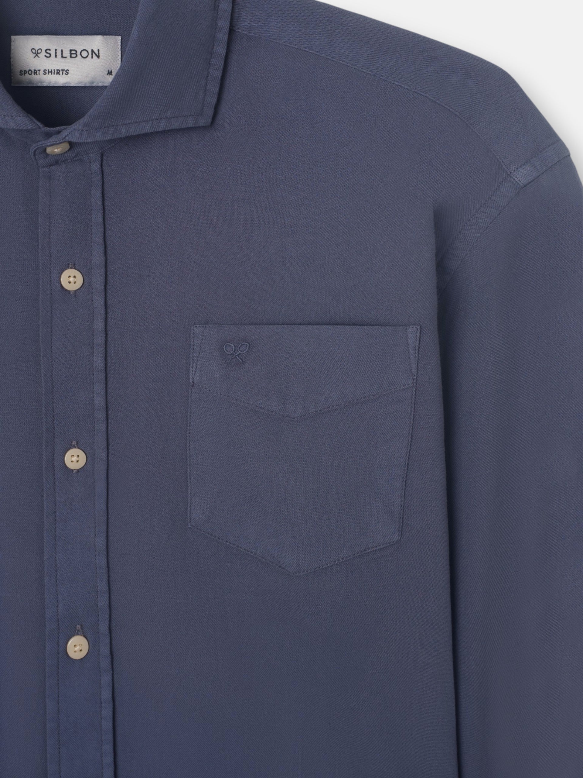 Blue worn pocket sport shirt