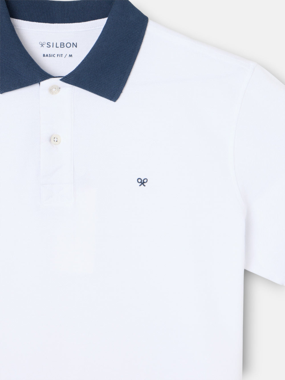 Polo manga corta ribete azul marino blanco