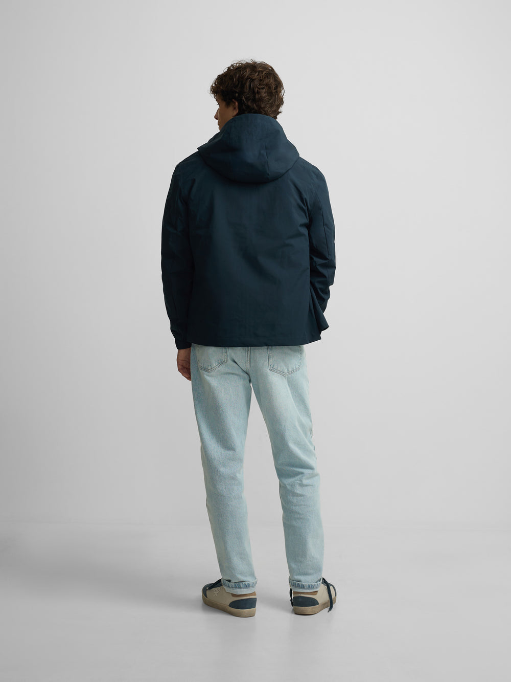 Technical windbreaker with navy blue hood