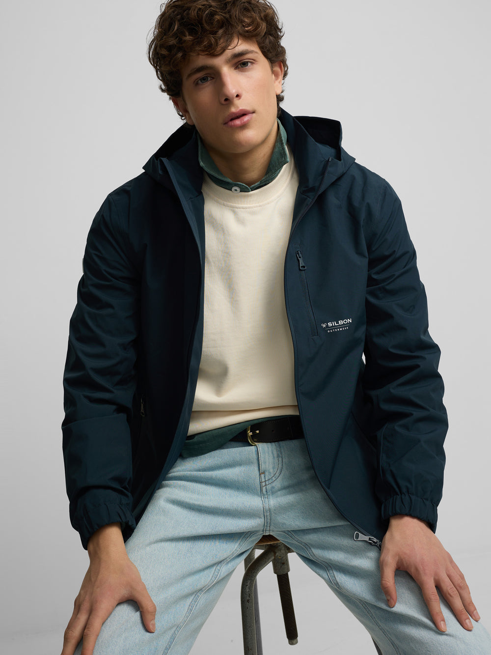 Technical windbreaker with navy blue hood