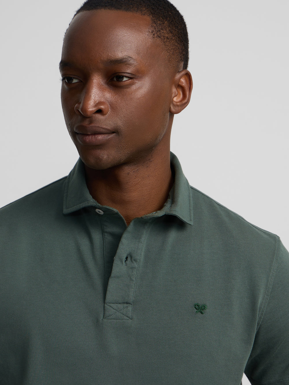 Polo manga corta logo relieve verde