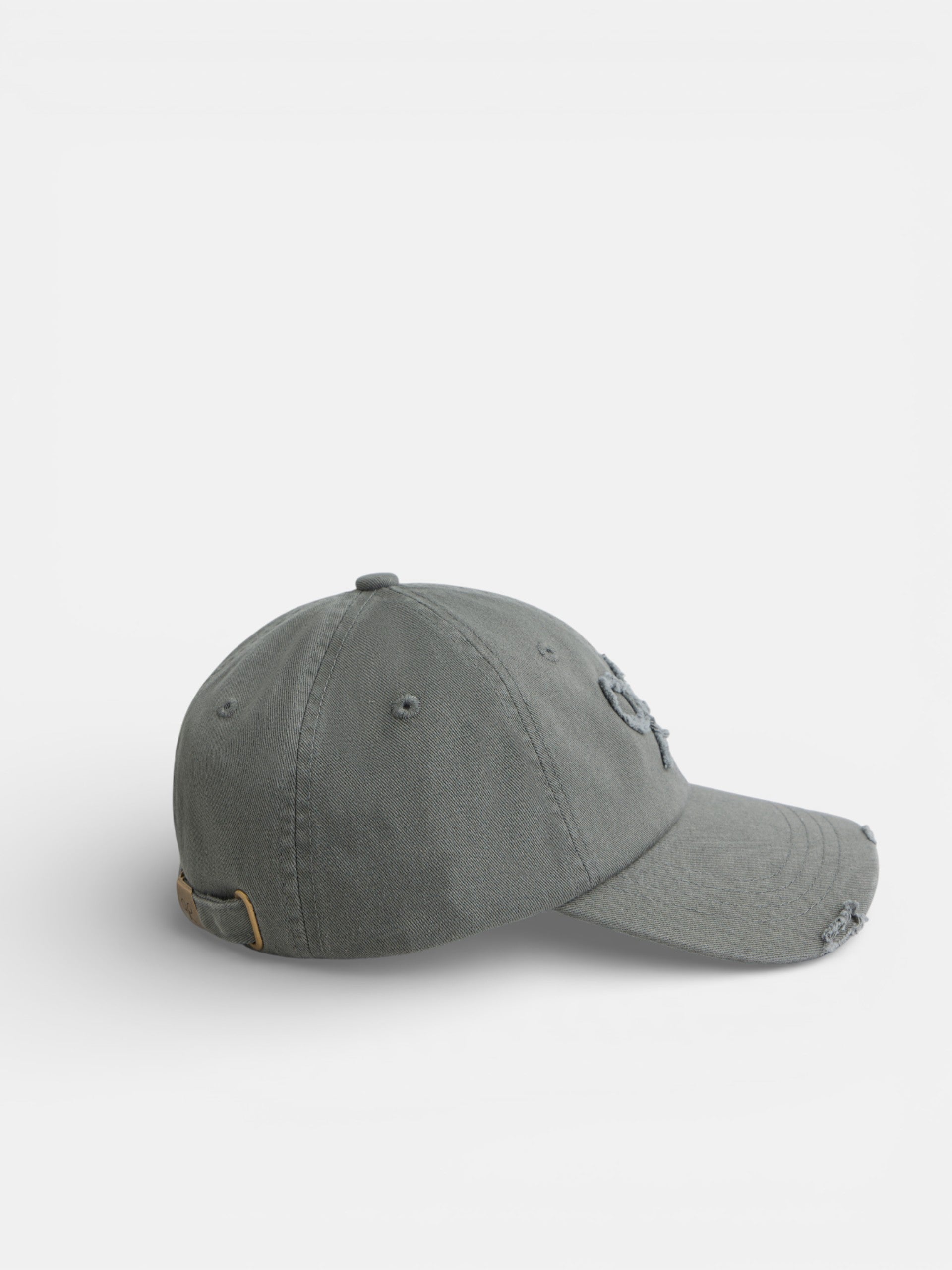 Casquette verte à motif raquette en relief