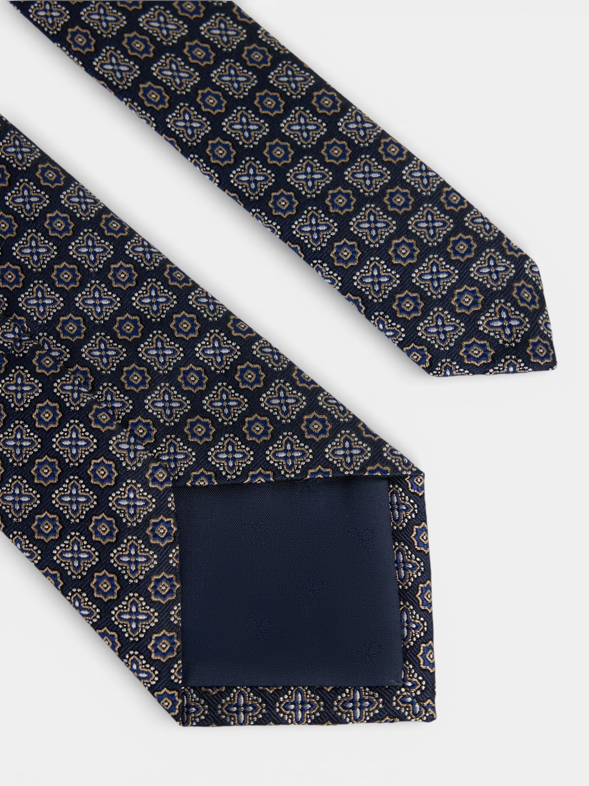 Cravate motif fleur bleu marine