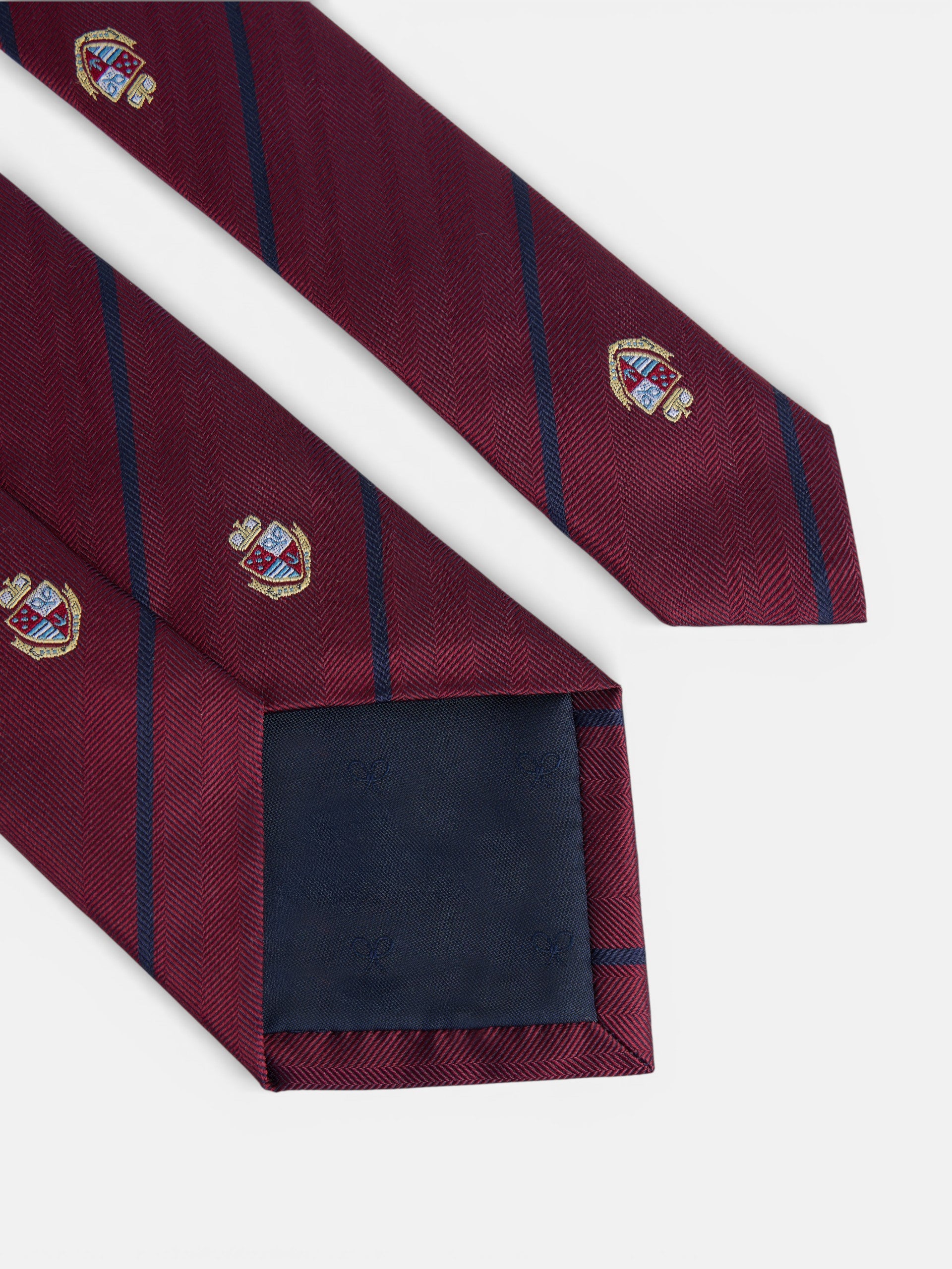Gravata às riscas com escudos bordô