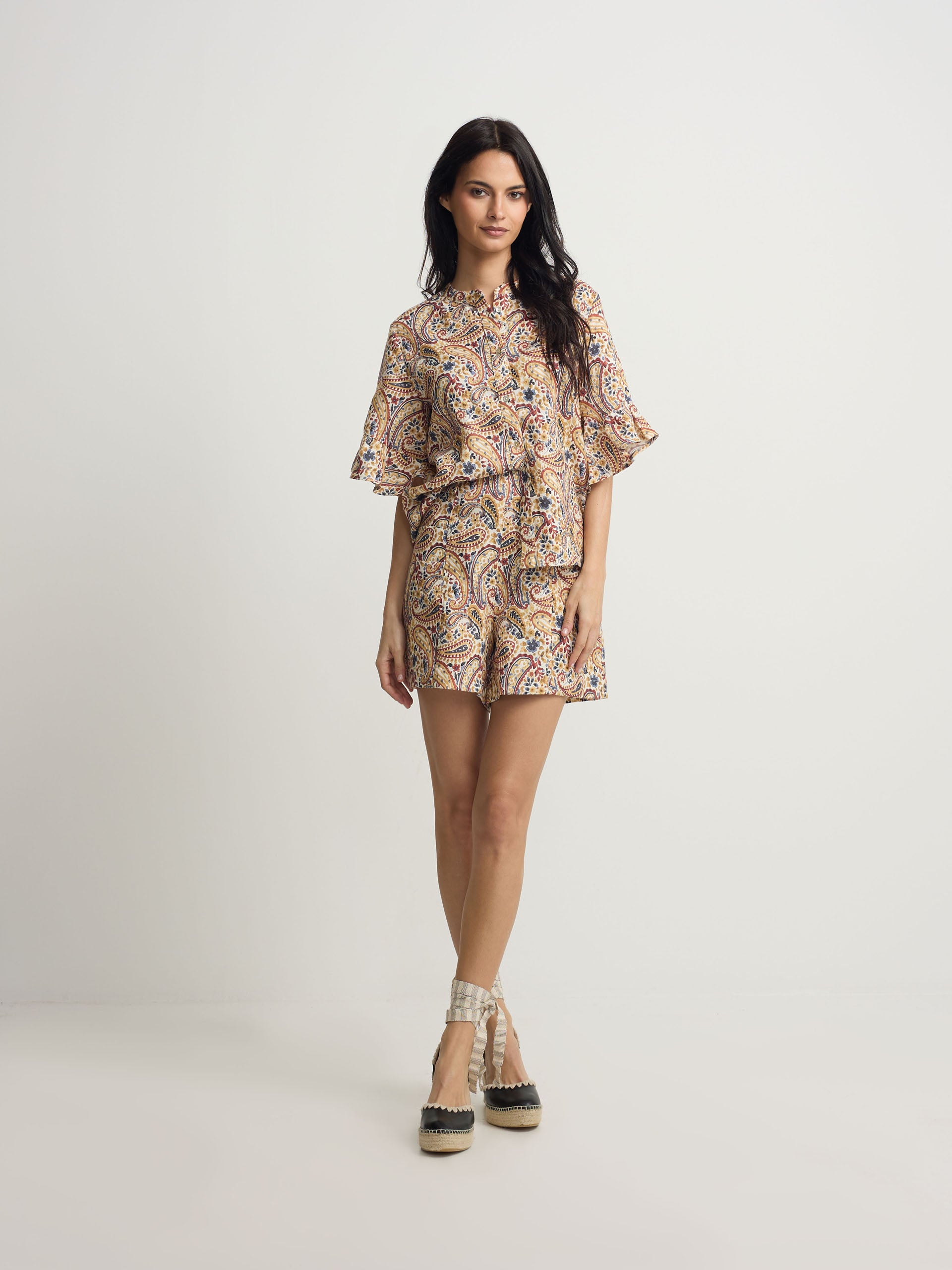 Orange paisley print linen Bermuda shorts