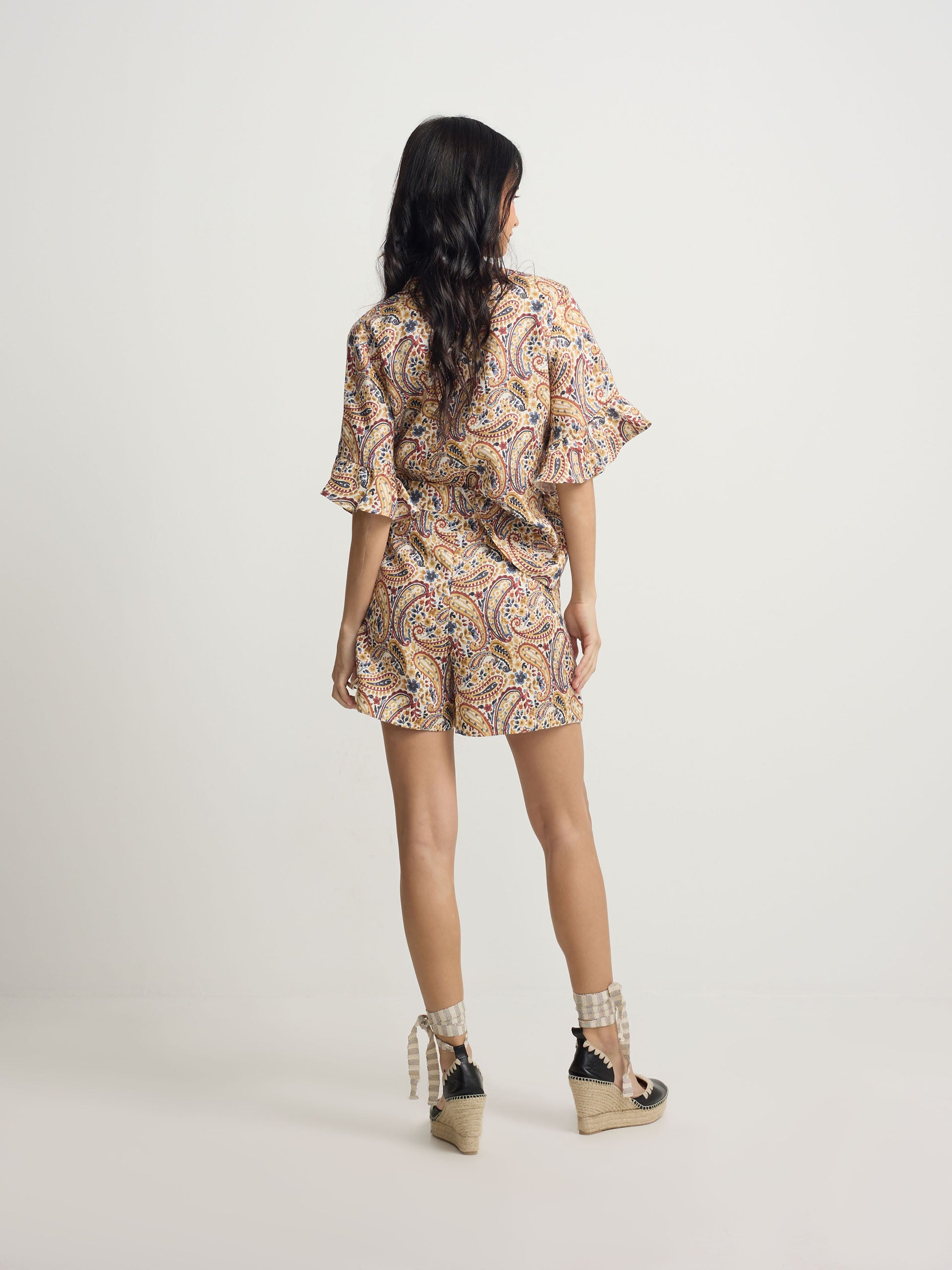 Orange paisley print linen Bermuda shorts