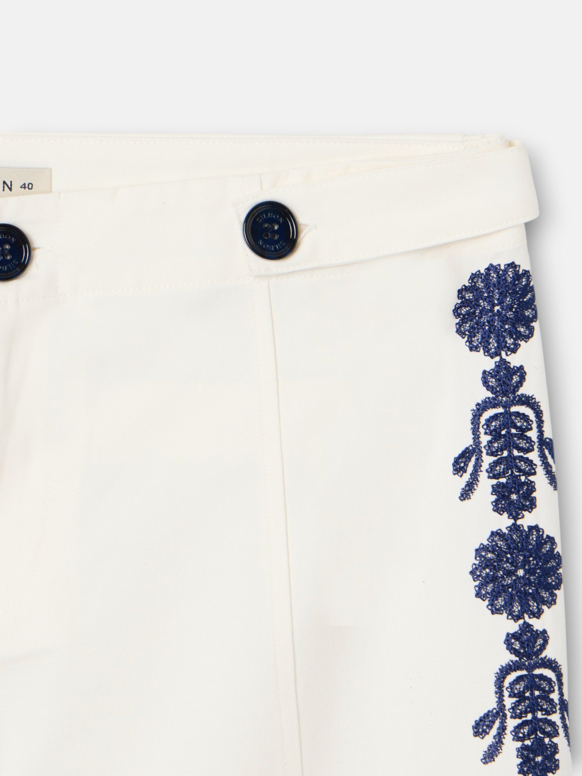 Straight pants with embroidered details in white