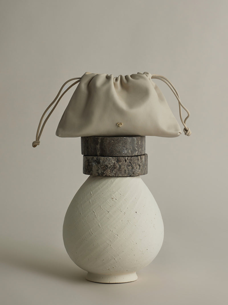 Gathered leather bag with chain detail in off-white