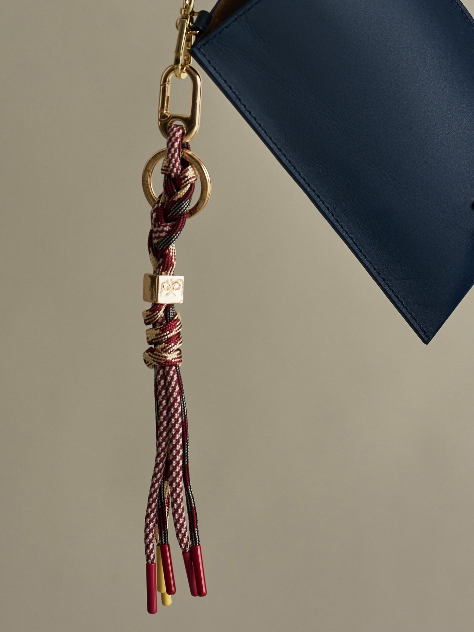 Golden and burgundy rope keychain