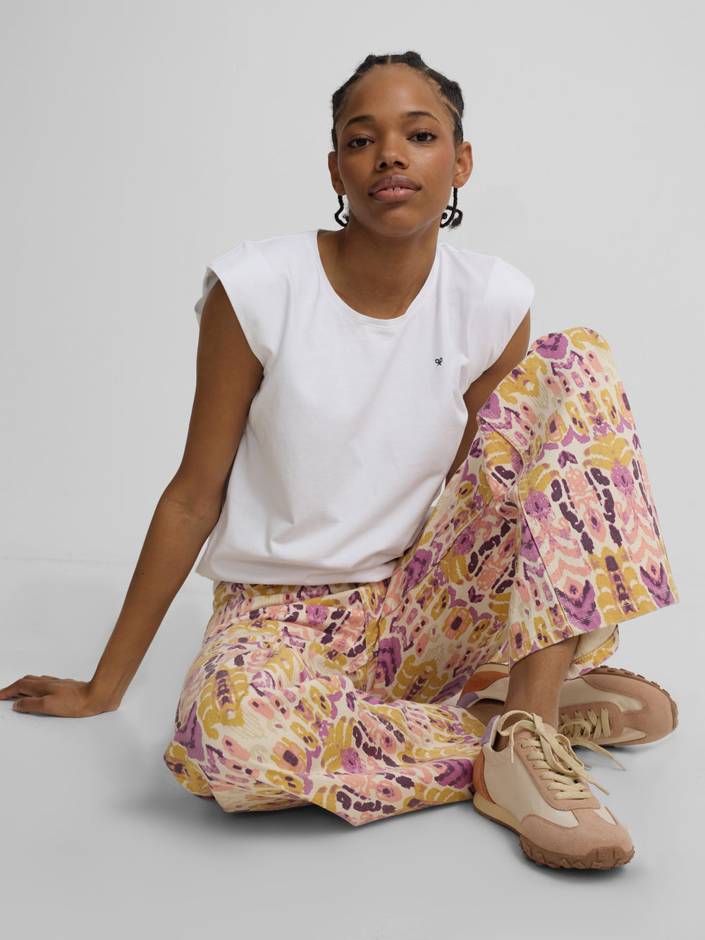 Ikat print denim trousers with roses
