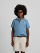 Polo enfant uni logo bouclé bleu moyen