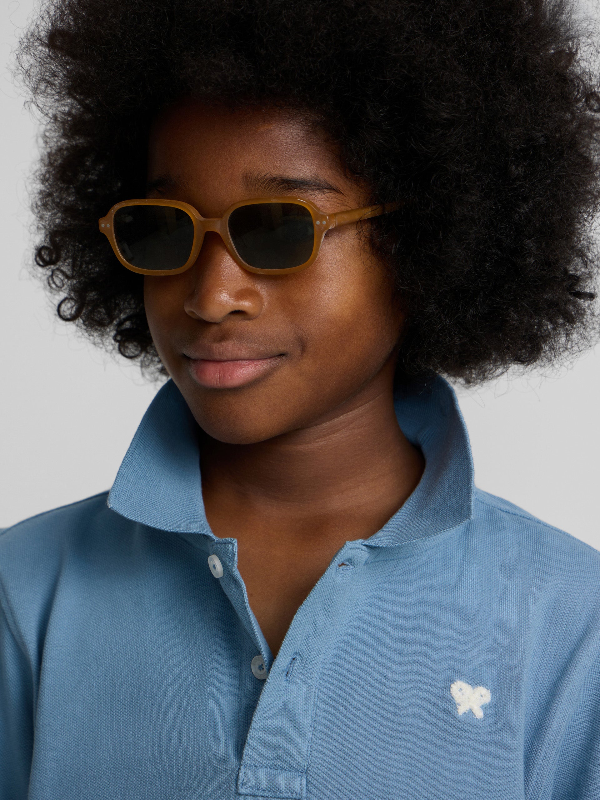 Polo enfant uni logo bouclé bleu moyen
