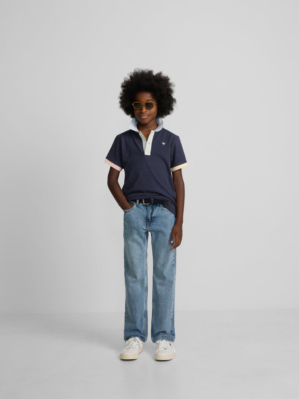 Navy blue kids polo with multicolor trim