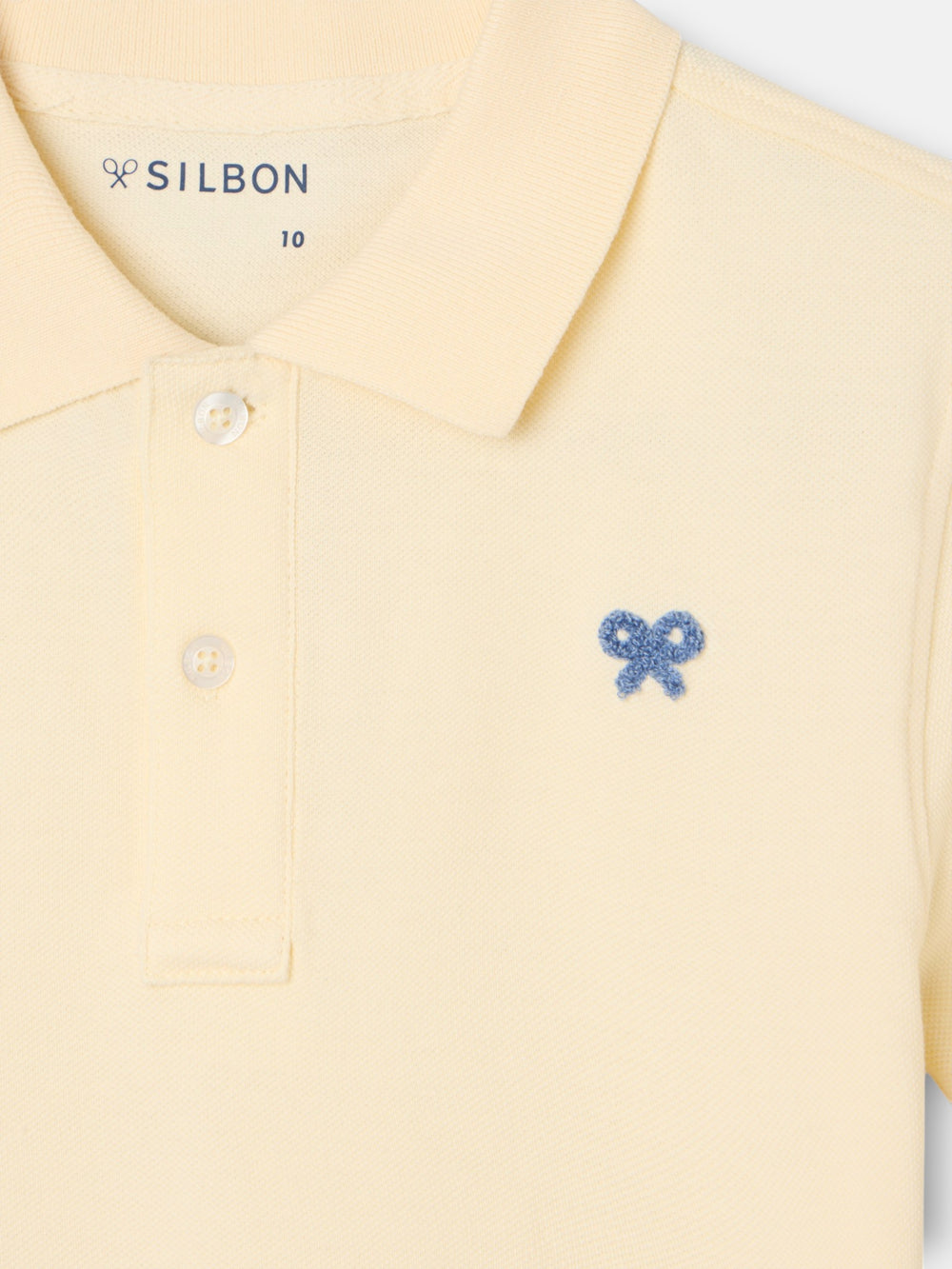 Polo enfant uni logo bouclé jaune