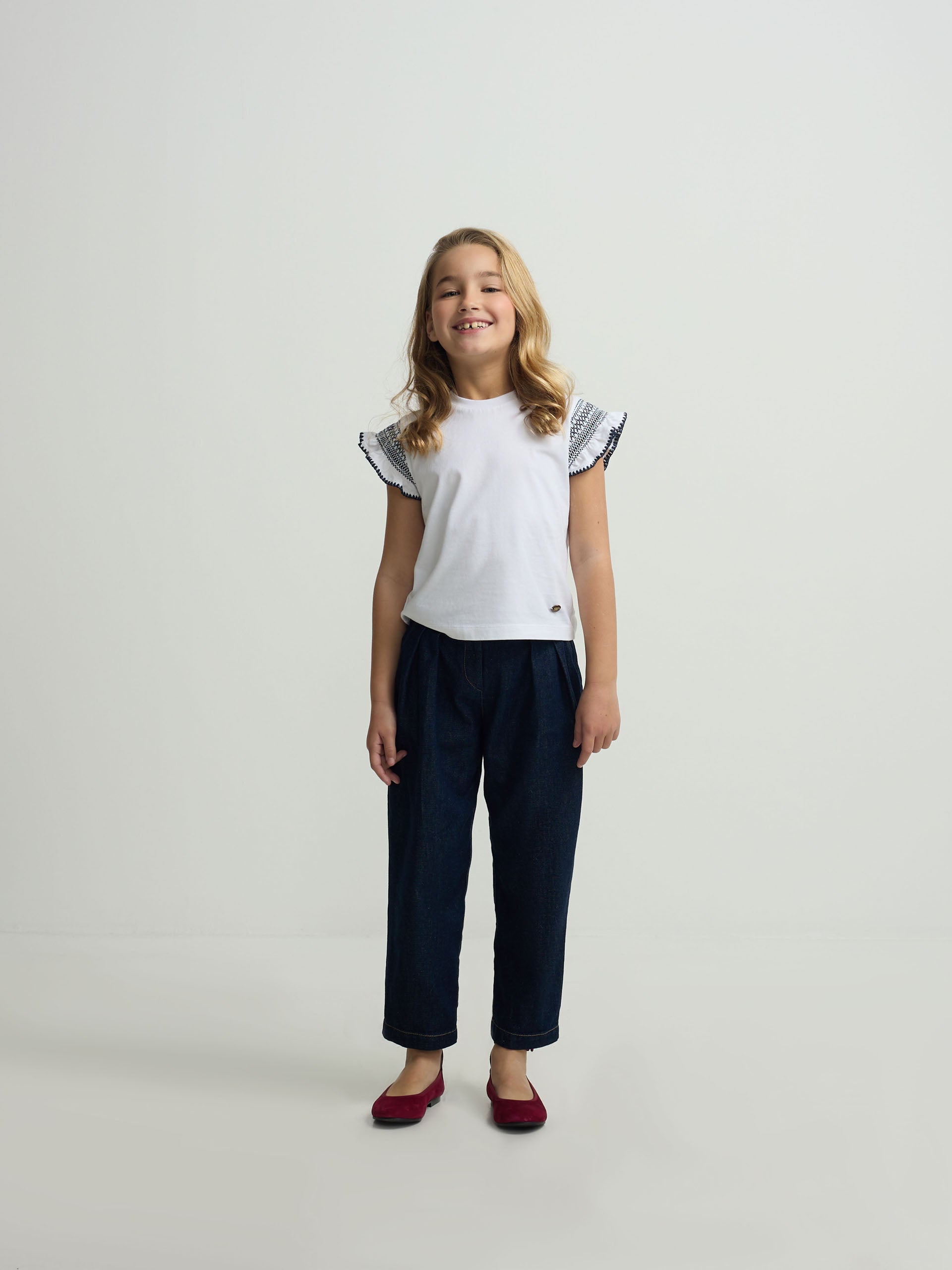 White girl’s t-shirt with embroidered sleeves