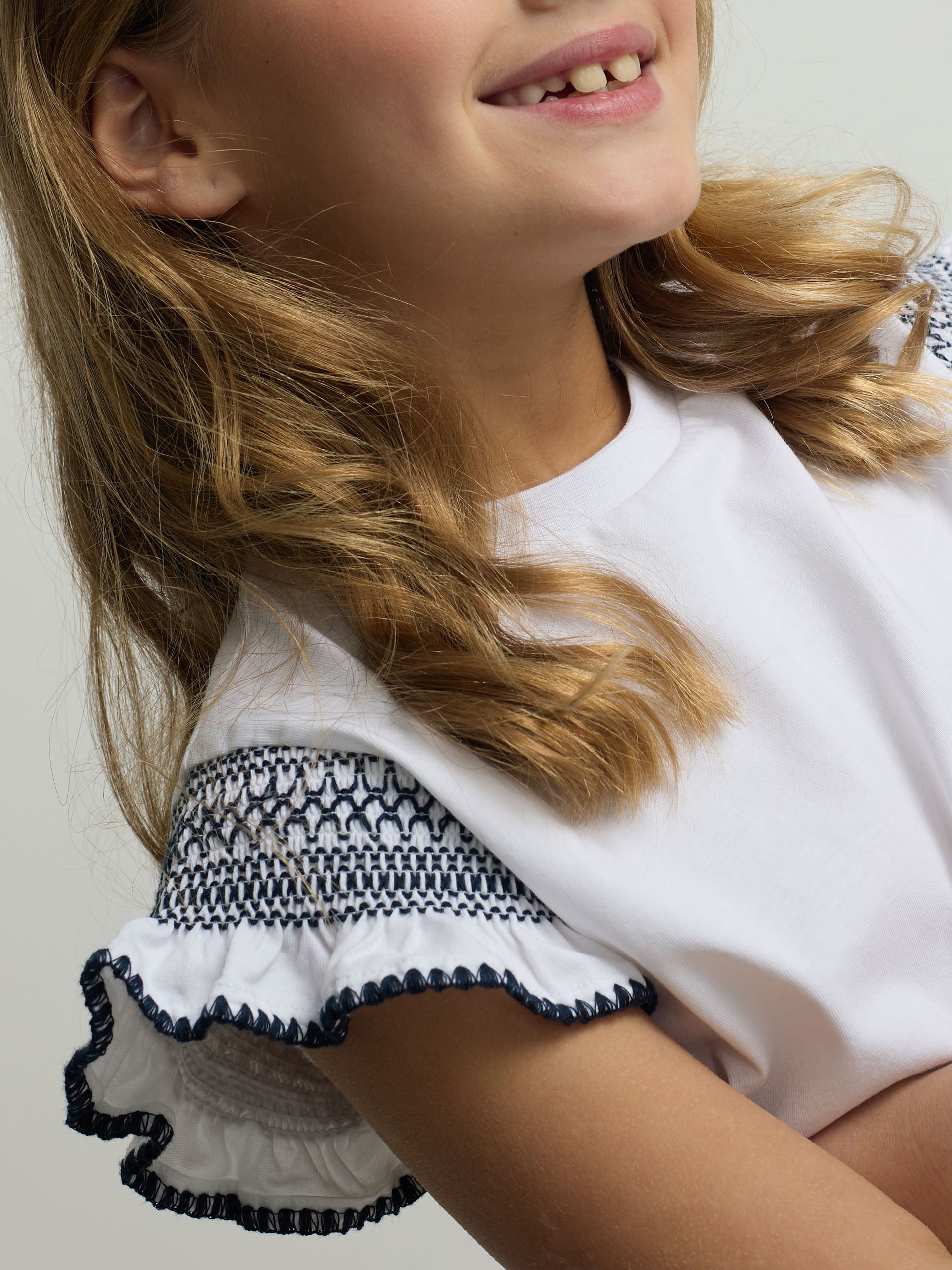 White girl’s t-shirt with embroidered sleeves